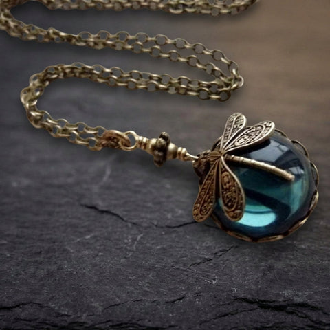 Blue Crystal Dragonfly Necklace In Antique Gold